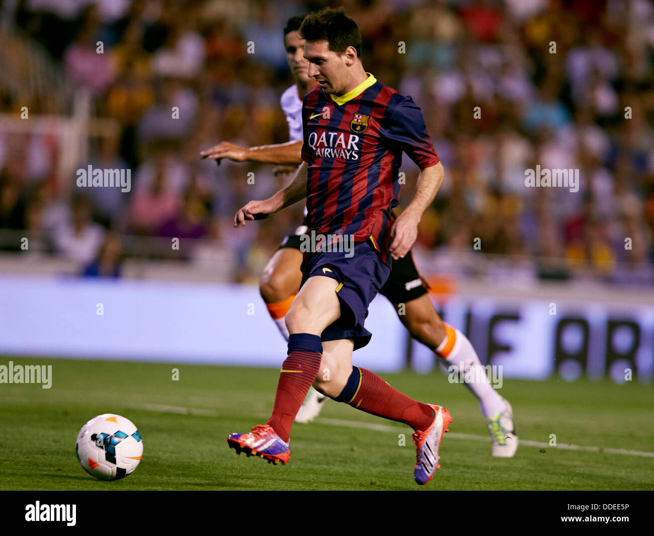 Valencia, Spain. 1st Sept, 2013. . Forward Lionel Messi of FC Barcelona (L)  is challenged by Defender Ricardo Costa of Valencia CF during the Spanish La Liga game between Valencia and Barcelona from the Mestalla Stadium. Credit:  Action Plus Sports Images/Alamy Live News Stock Photo