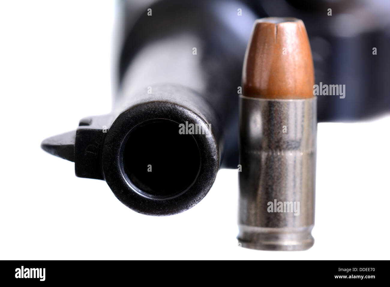 Isolated shot of an old Luger and a 9mm bullet Stock Photo