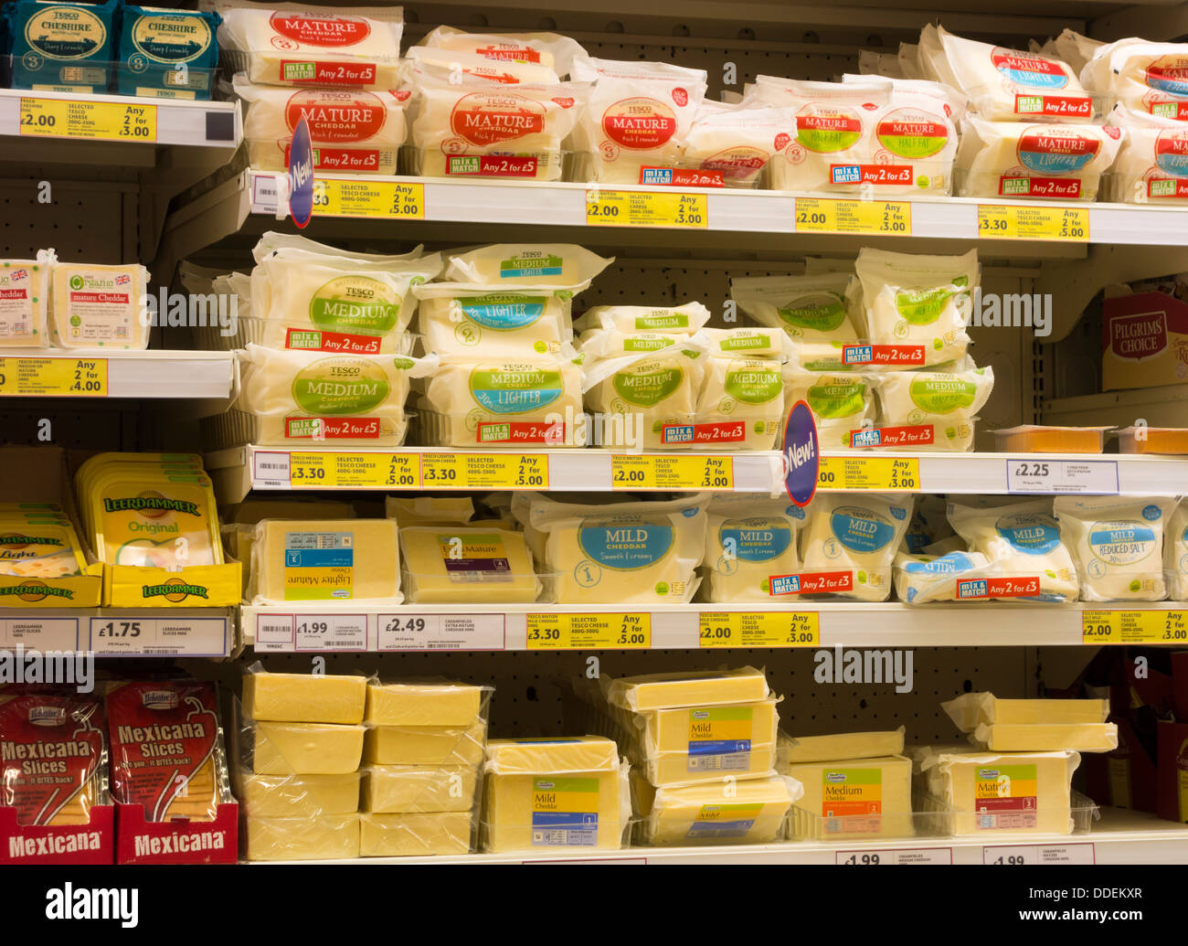 Cheese in plastic packaging in Tesco supermarket. UK Stock Photo Alamy