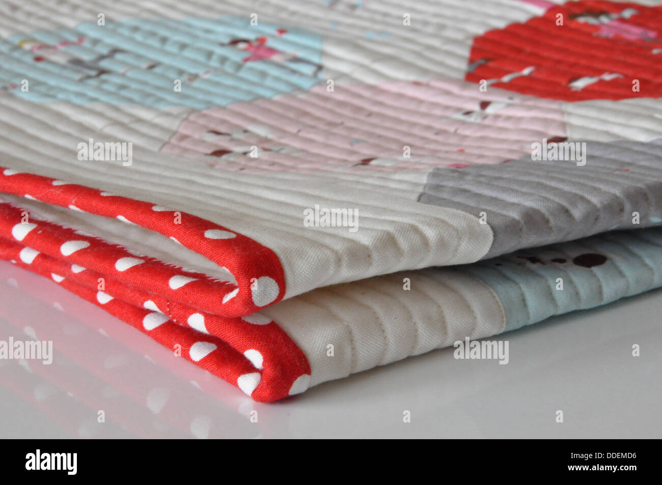 Red polka dot binding of a modern quilt Stock Photo