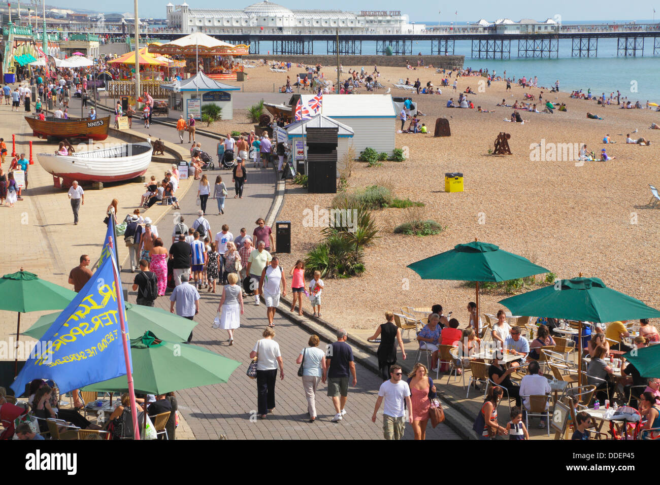 Brighton seafront attractions on the beach by the Pier, East Sussex, South Coast, England, UK Stock Photo