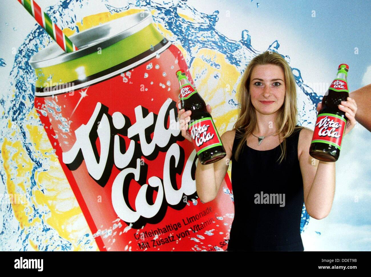 An employee of Waldquell GmbH from Thuringia holds two bottles of 'Vita Coke' into the camera' on the 4th of August in 1999. Stock Photo