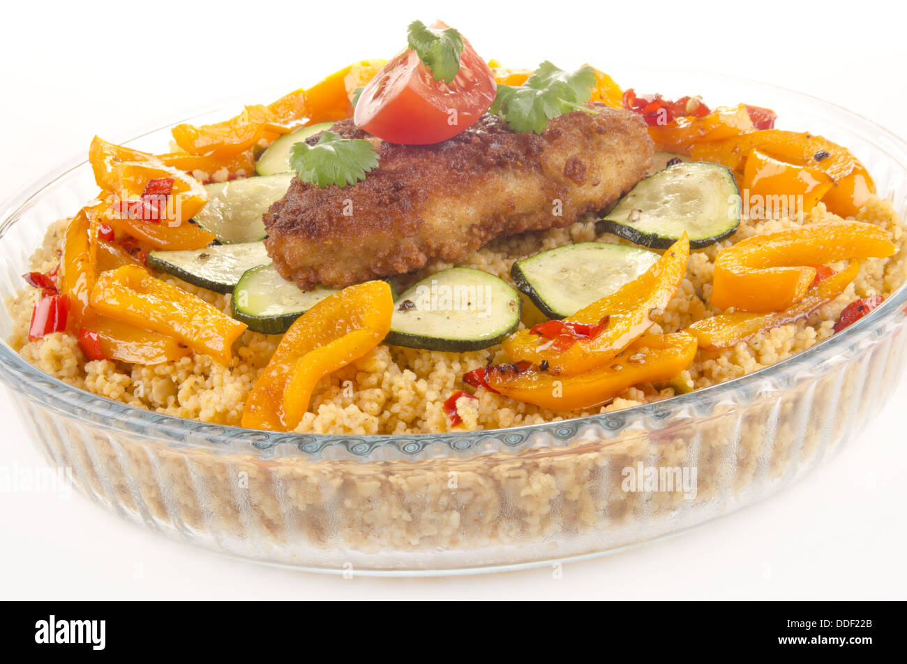Couscous with courgette and breaded chicken steak Stock Photo Alamy