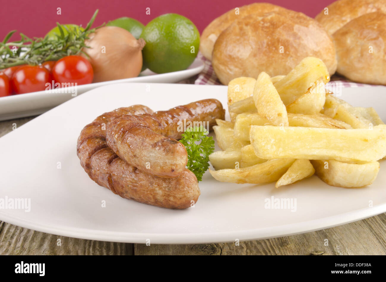 grilled sausages with french fries Stock Photo Alamy