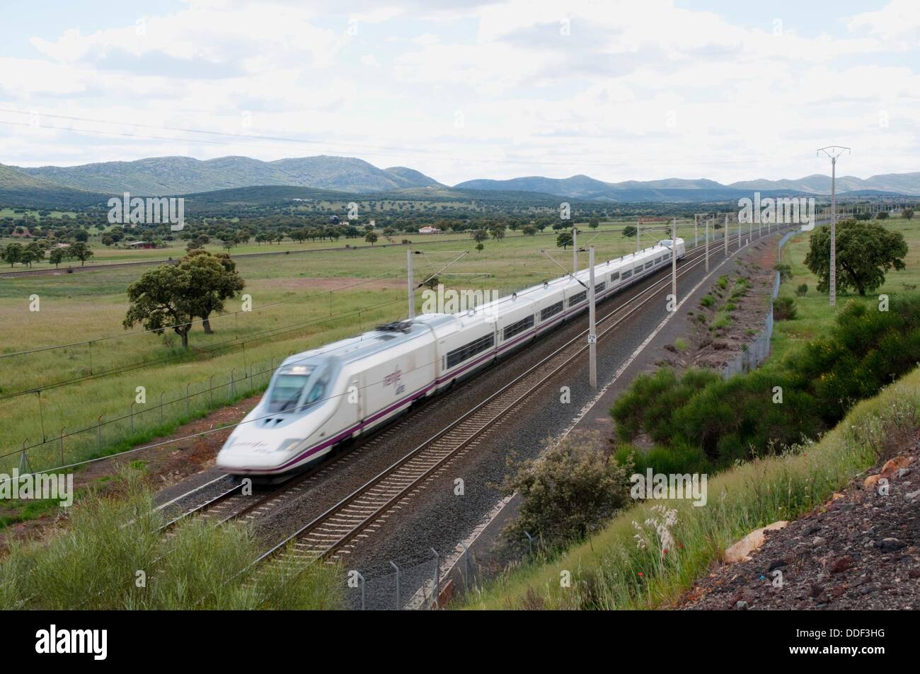 AVE High-speed train Madrid-Sevilla traveling along La Mancha. Puertollano, Ciudad Real province, Castilla La Mancha, Spain. Stock Photo