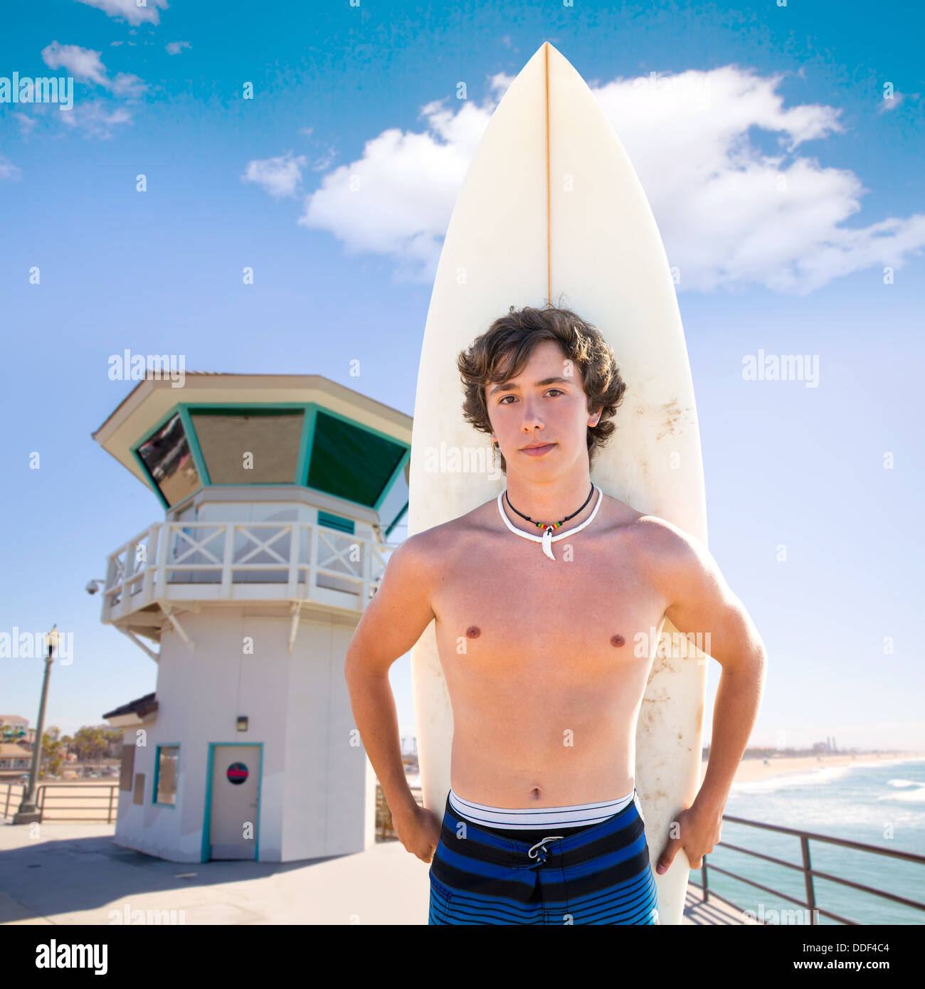 Surfer boy teenager with surfboard in Huntington beach pier California  Stock Photo - Alamy