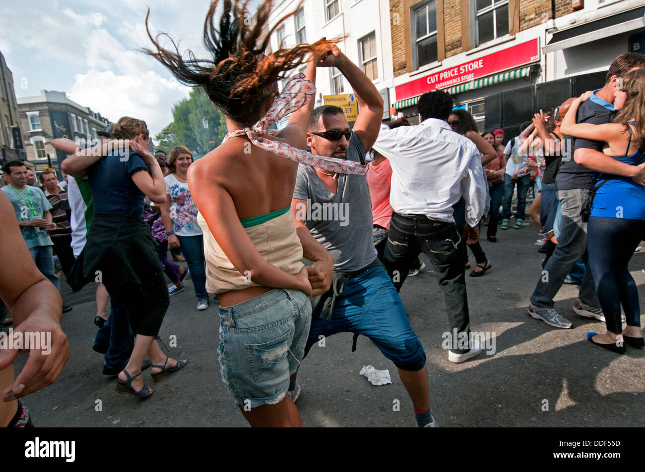 couples dancing to sound system in side street at Notting Hill Carnival ...