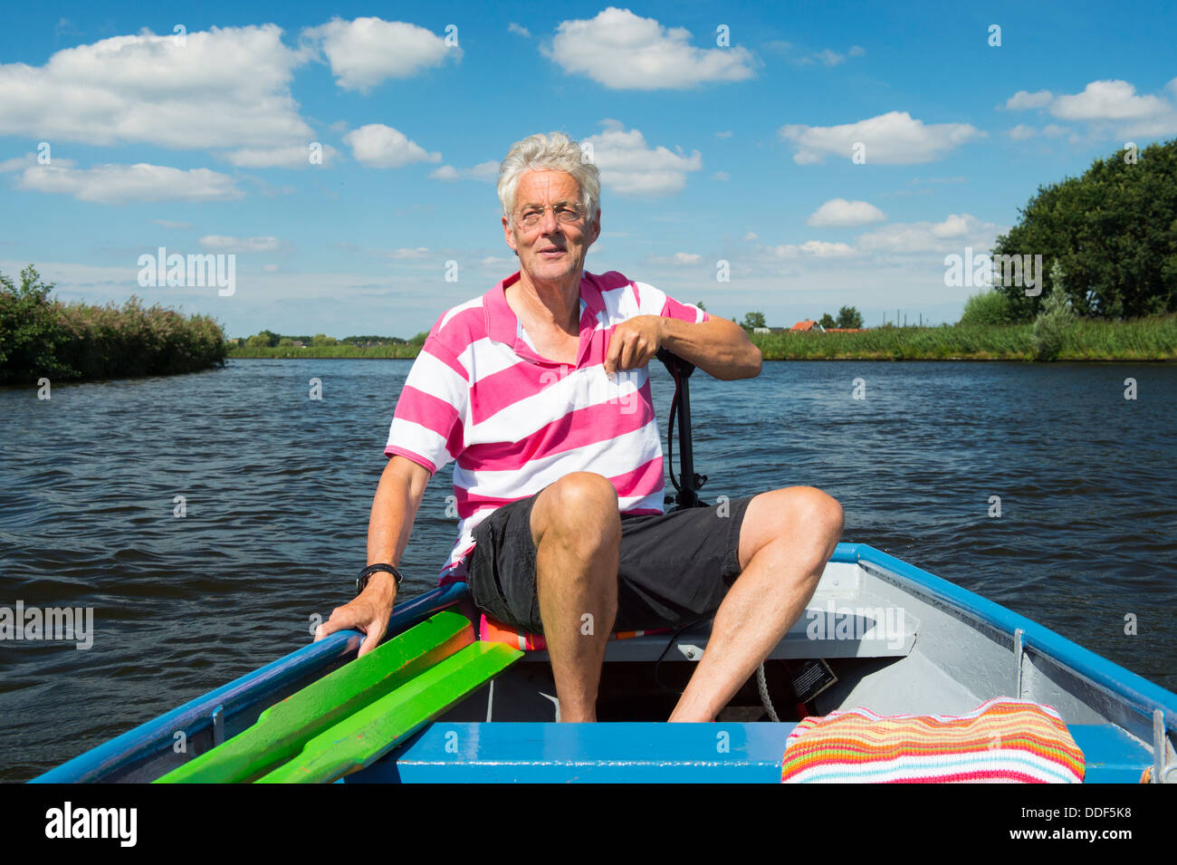 Rowing elderly man in boat hi-res stock photography and images - Alamy
