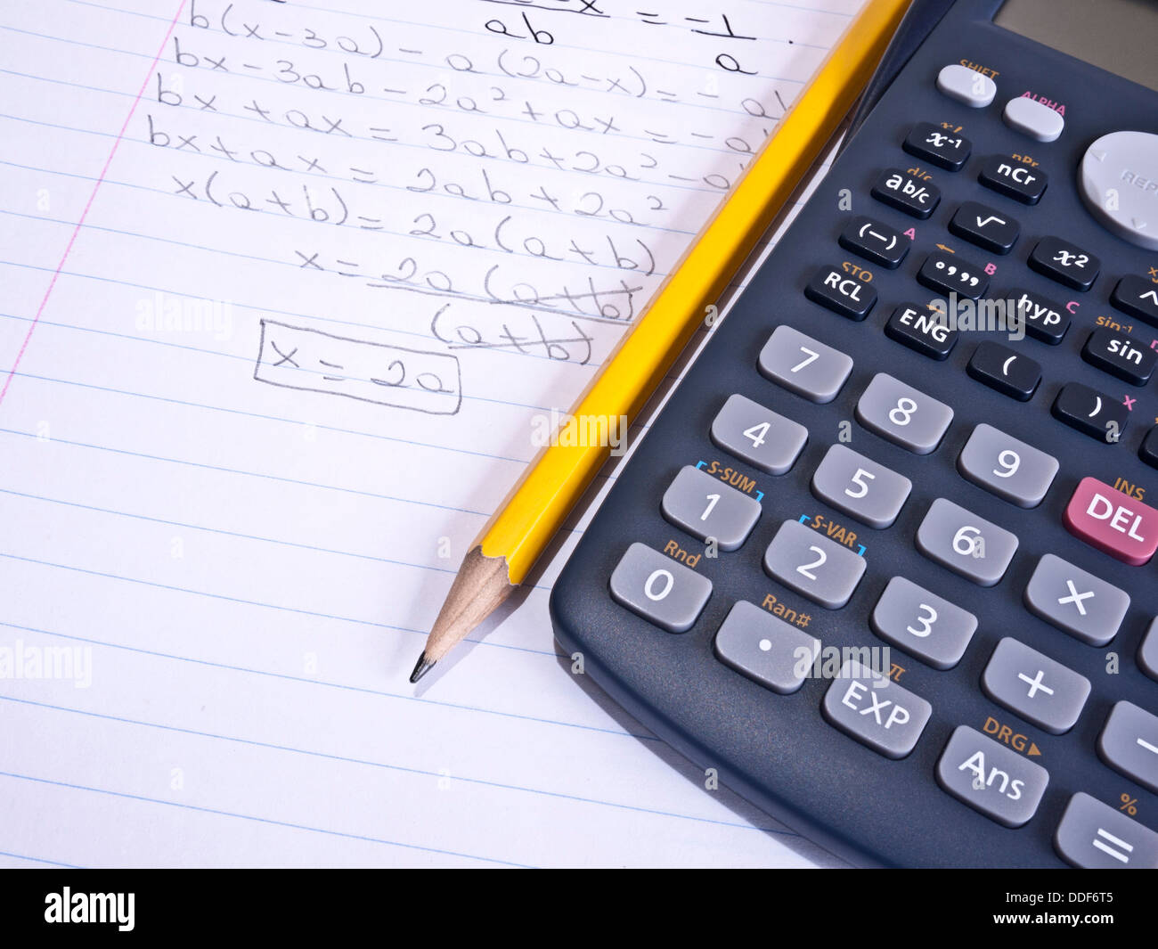 Macro Shot Of A Calculator Over A Page With A Math Problem And A