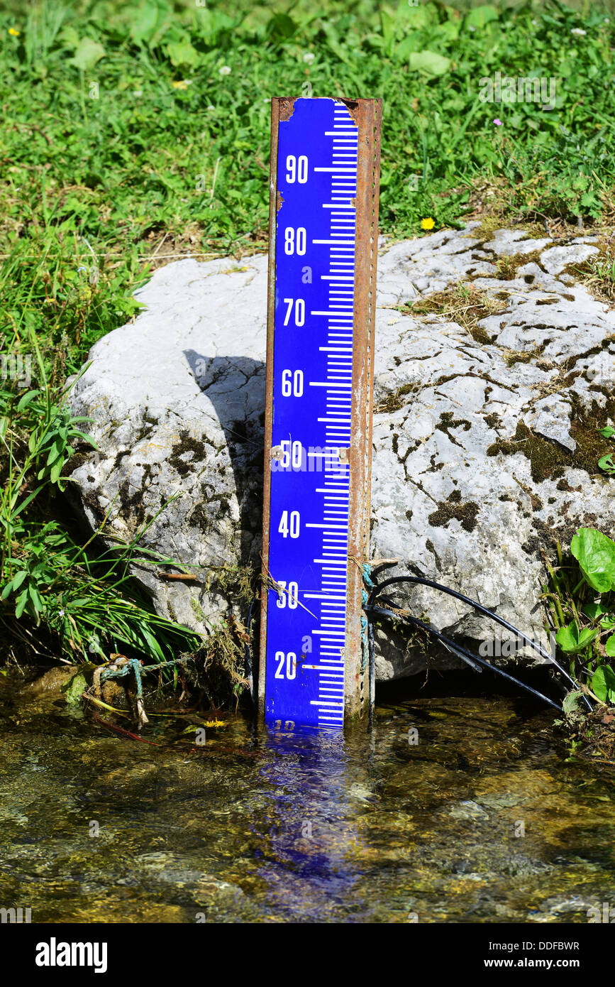 Water level marker in a river Stock Photo