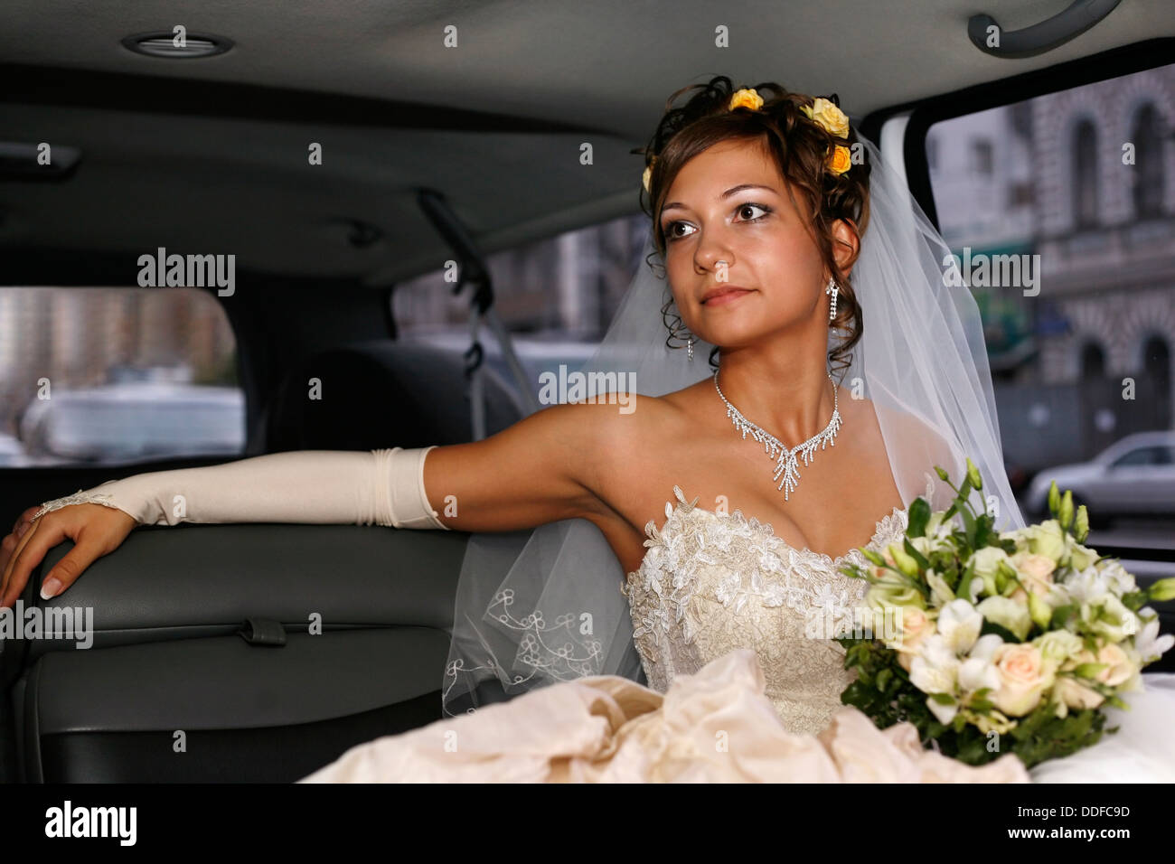 Bride in car Stock Photo - Alamy