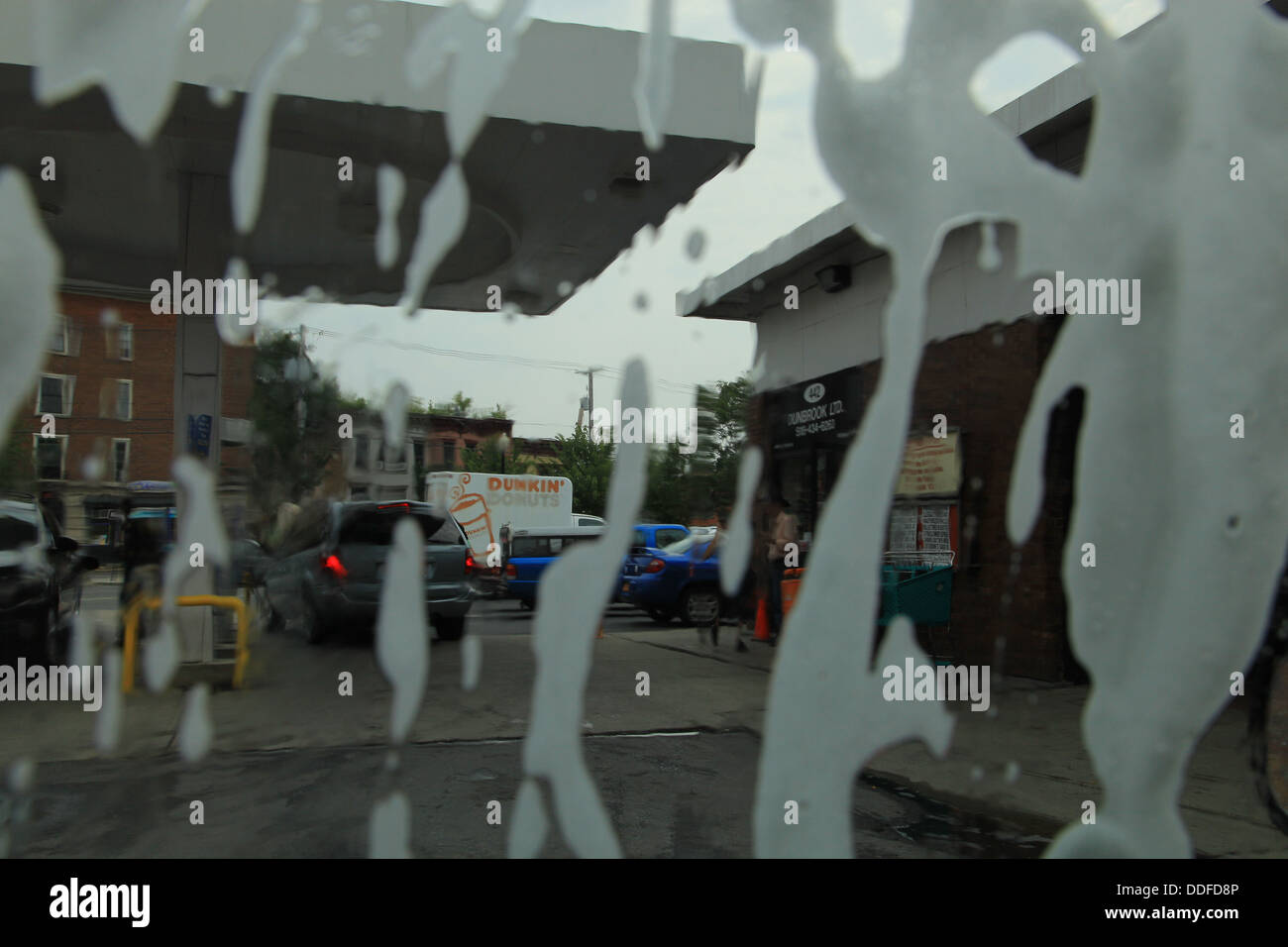 Soap suds on car window in car wash hires stock photography and images