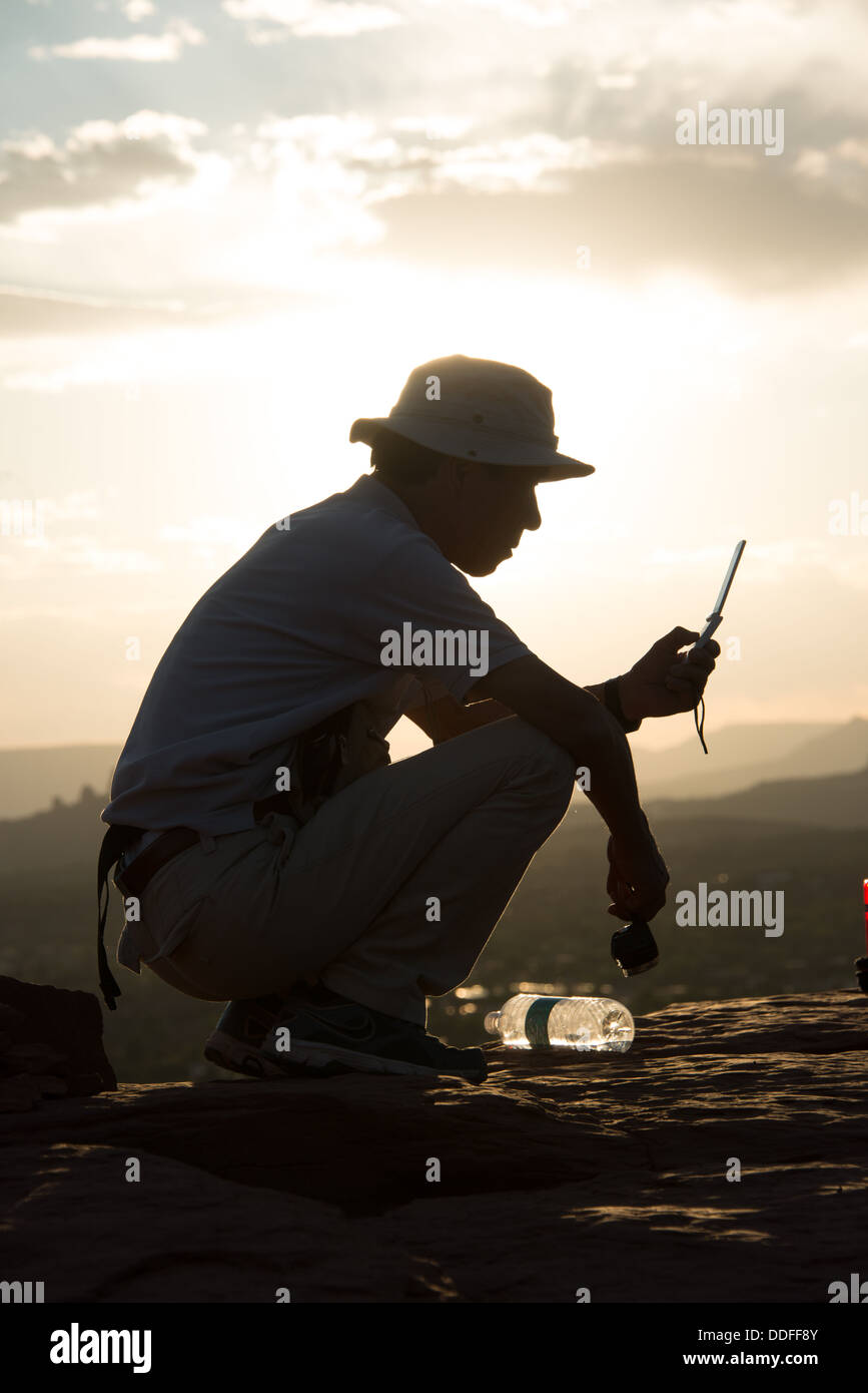 Man Texting Airport Vortex Sedona Arizona Stock Photo