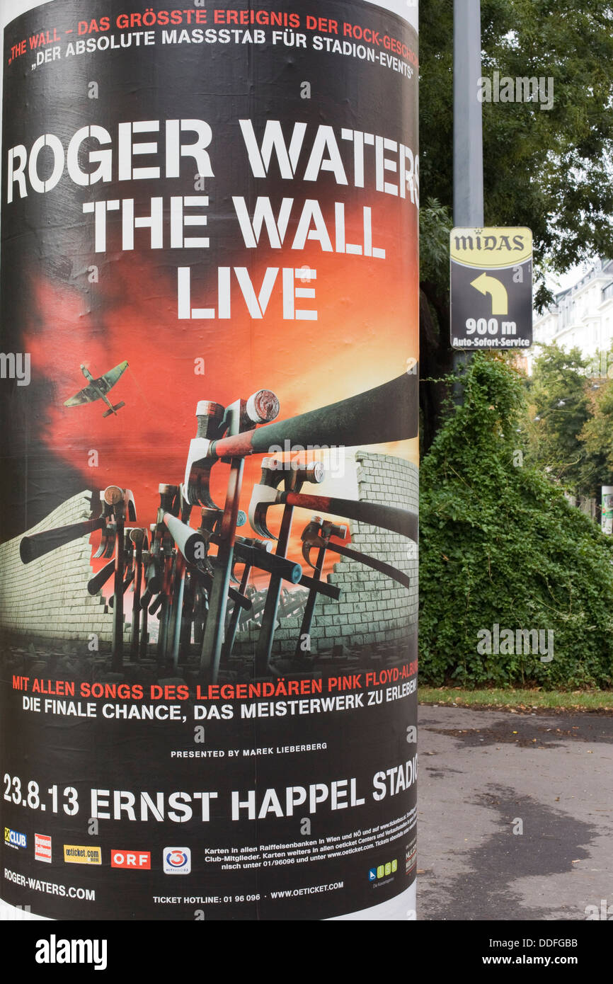 Poster on a stone pillar advertising Roger Waters ' The Wall' Live in Vienna Austria Stock Photo