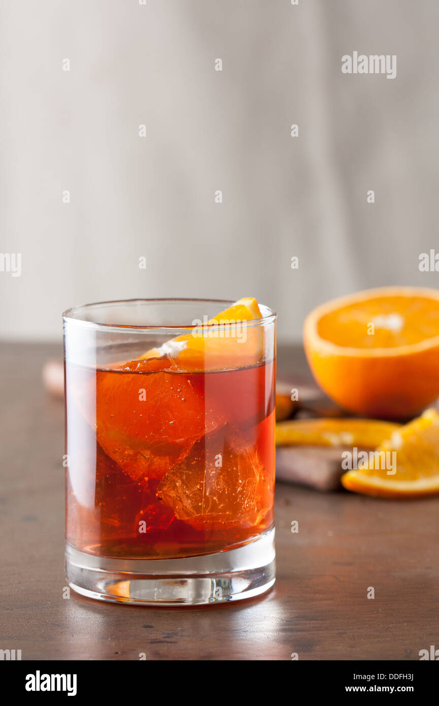 Classic americano cocktail with an orange slice on wooden table Stock Photo