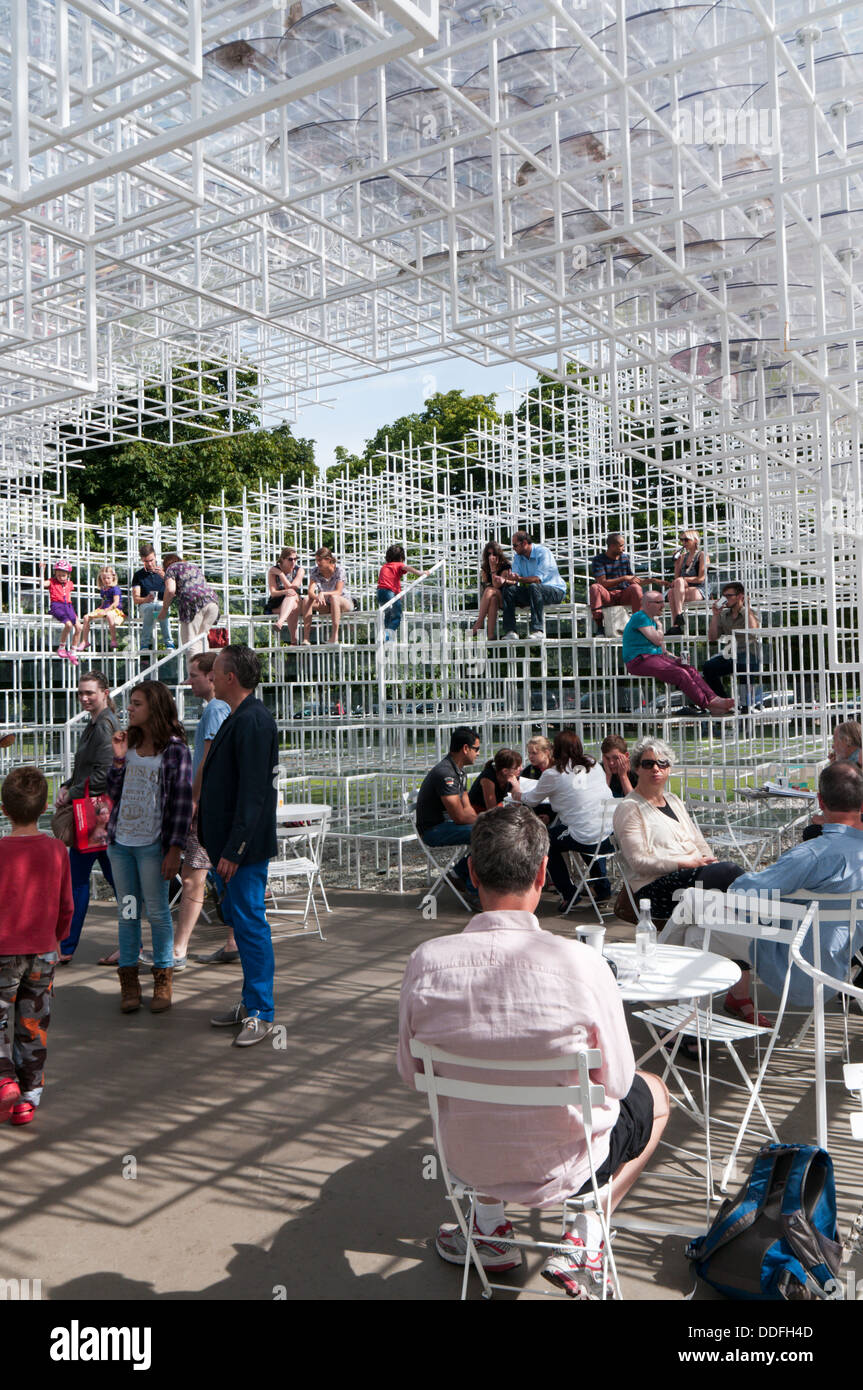 Visitors at the cafe inside the 2013 Serpentine Gallery Summer Pavilion designed by the Japanese architect Sou Fujimoto. Stock Photo