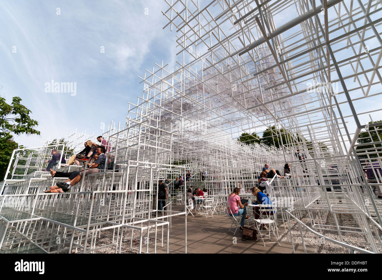 Visitors enjoying the 2013 Serpentine Gallery Summer Pavilion designed by the Japanese architect Sou Fujimoto. Stock Photo