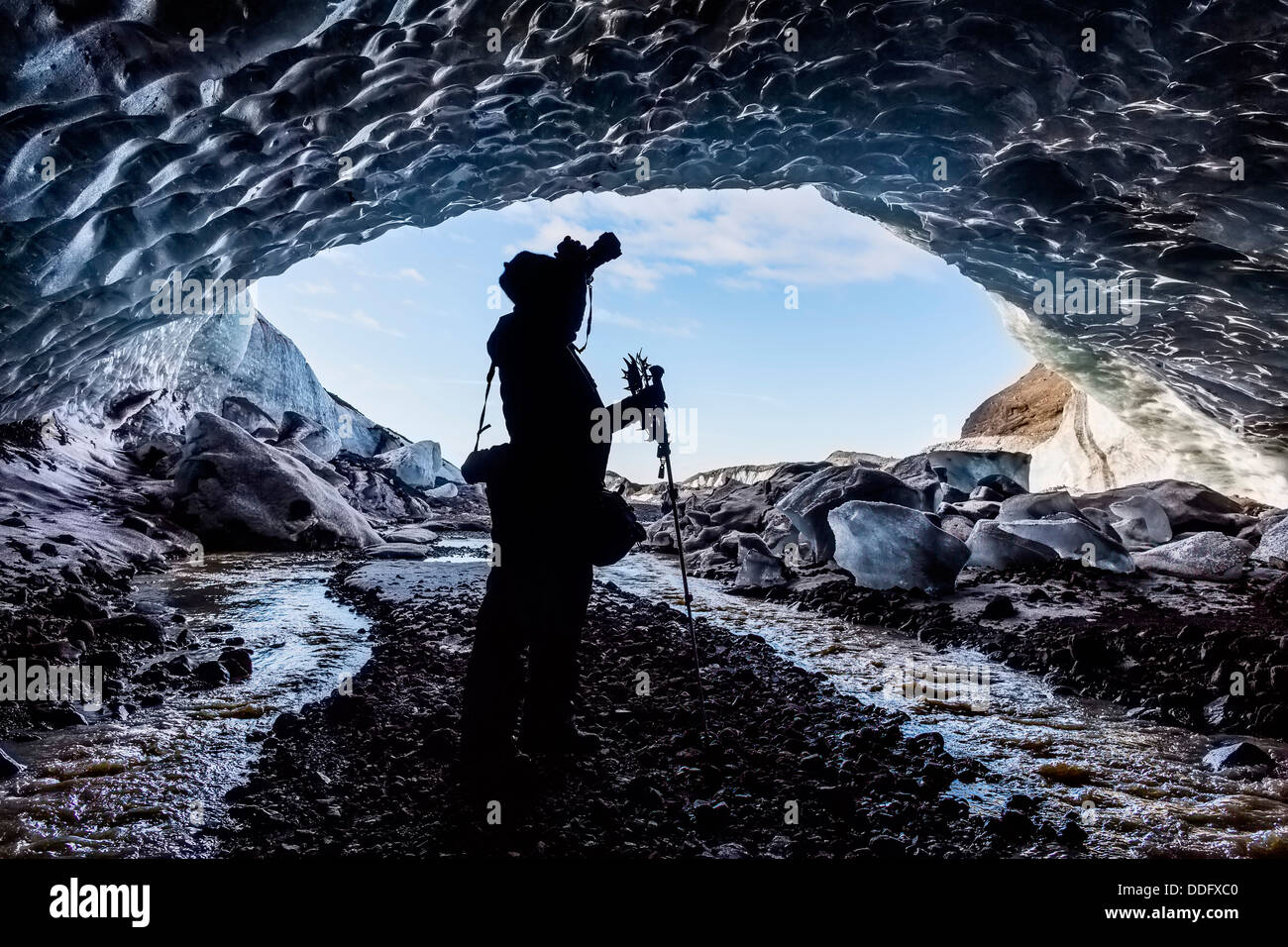 Photographing ice cave, Fallsjokull Glacier, Iceland Stock Photo