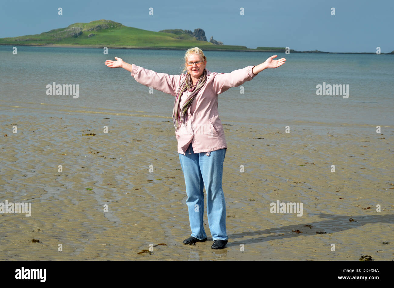 happy woman standing on a beach Stock Photo - Alamy