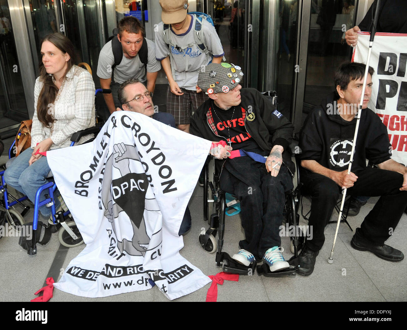 London, UK. 2nd Sep, 2013. Members of the protest group, Disabled People Against the Cuts (DPAC) block the entrance to the BBC. The protest is to highlight what they claim is a lack of coverage of the consequences of government cuts on disabled people in on BBC News programming. Credit:  Pete Maclaine/Alamy Live News Stock Photo
