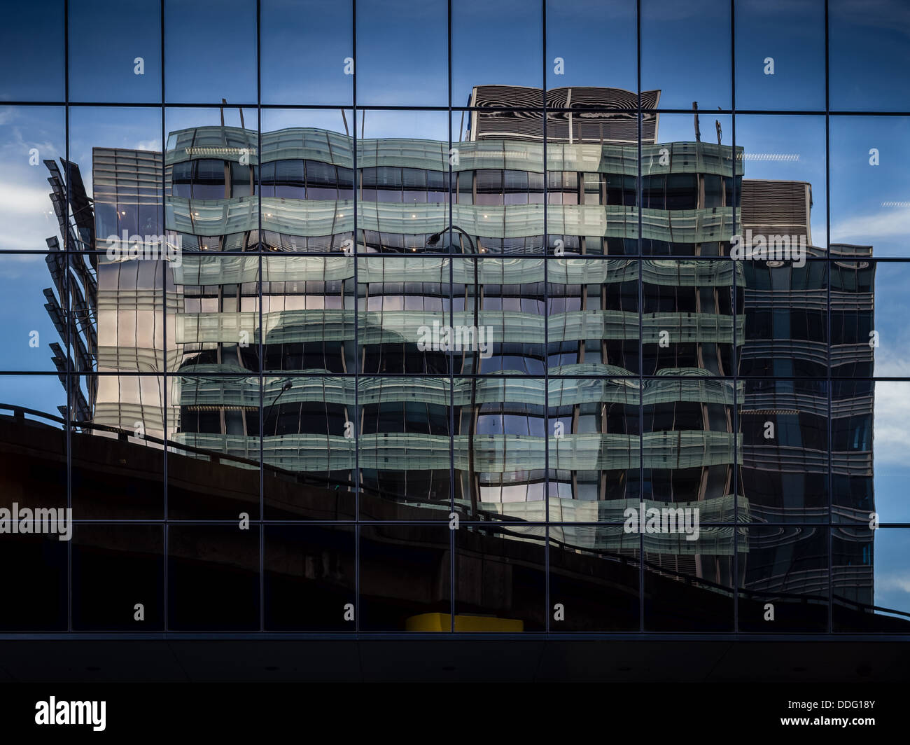 A rippling reflection of an office building Stock Photo - Alamy
