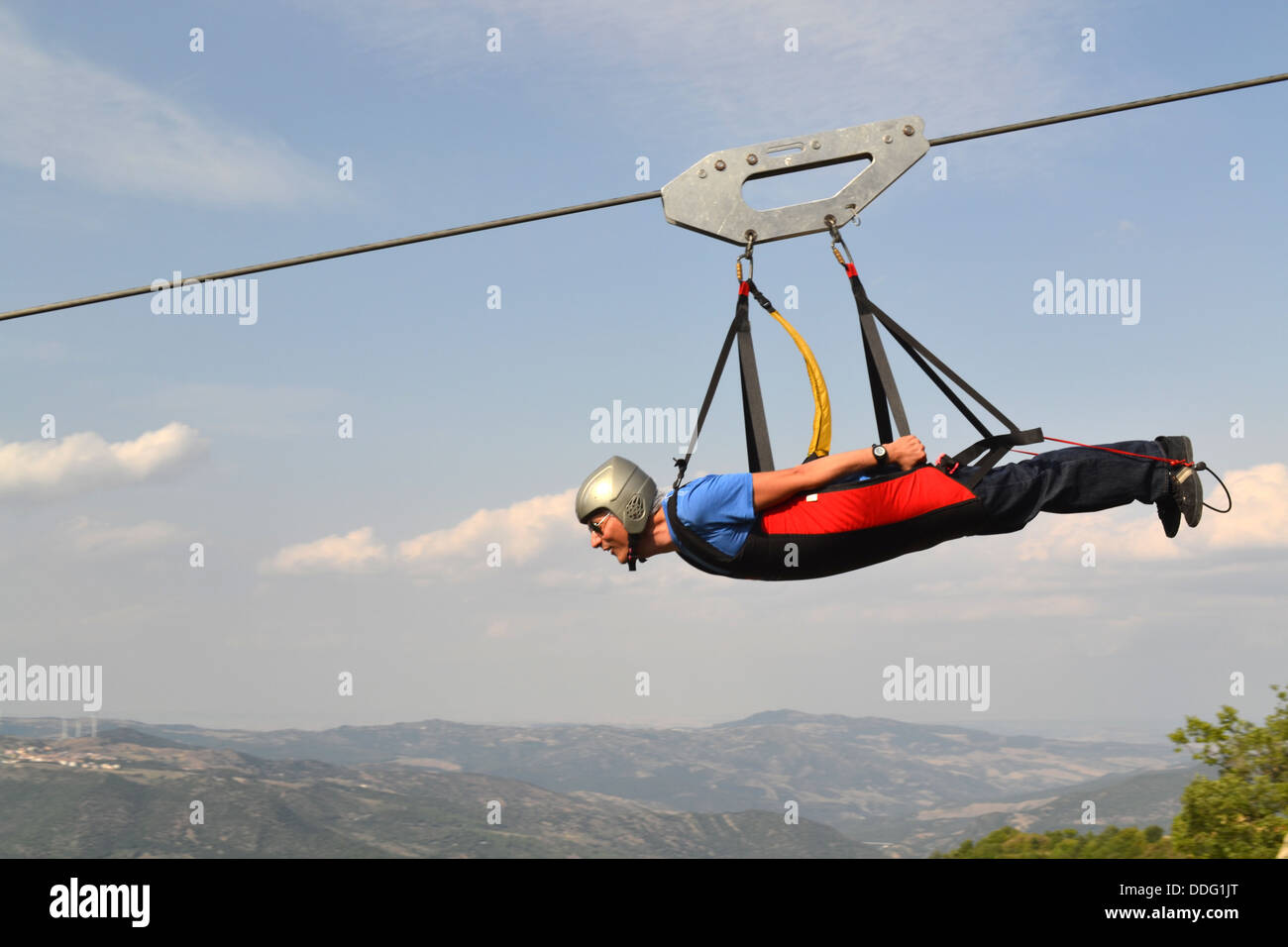 Man on zip wire between two mountains. The Volo dell'Angelo / Flight of the Angel. Adventure activity in Basilicata, South Italy Stock Photo