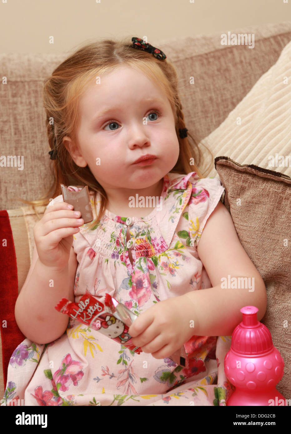 Toddler eating chocolate Stock Photo Alamy