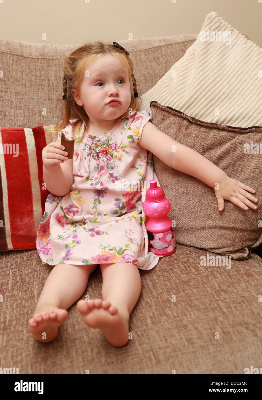 Toddler eating chocolate Stock Photo Alamy