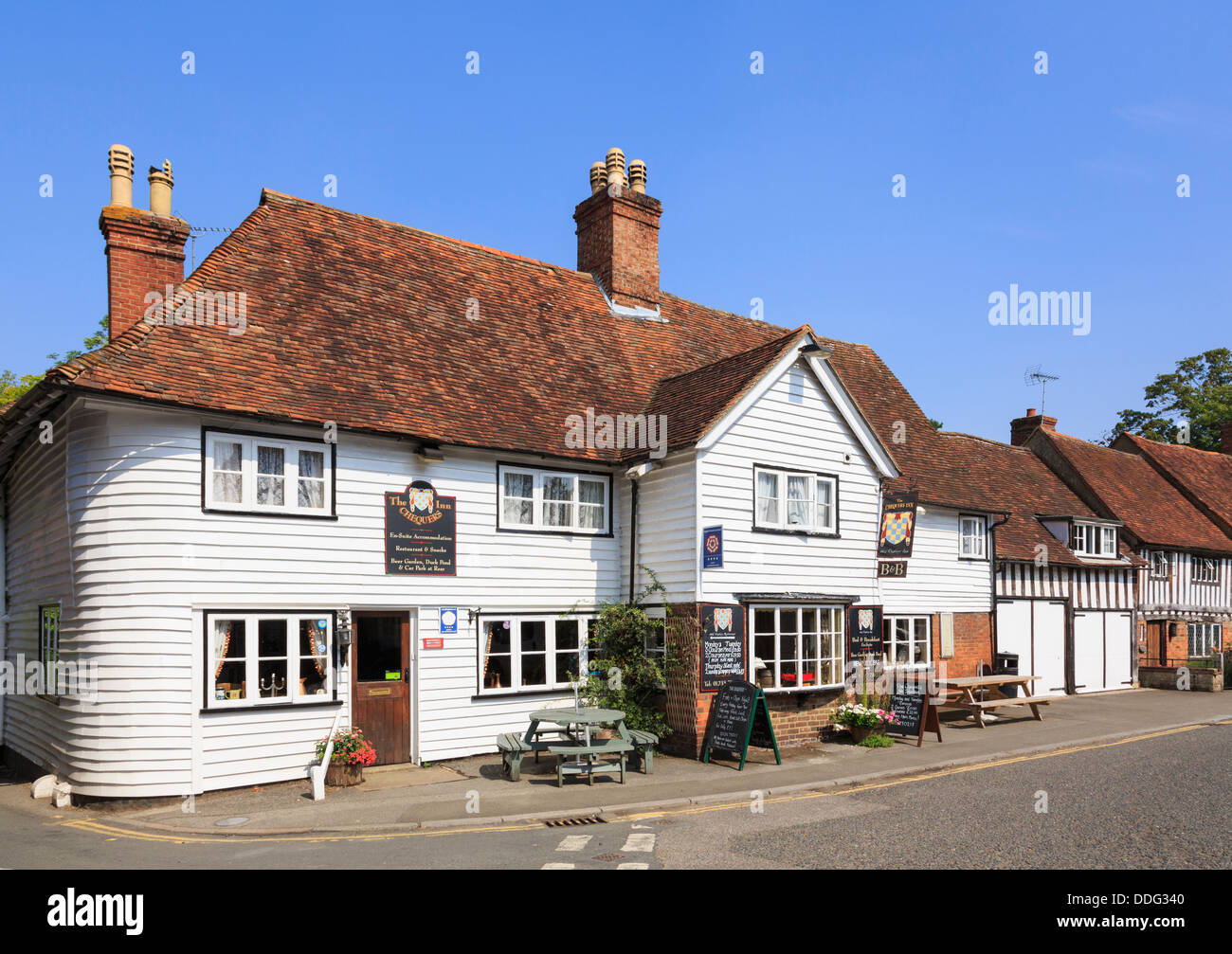 The Chequers 14th century coaching Inn in a typical white clapboard Kentish period building in picturesque village. Smarden Kent England UK Britain Stock Photo