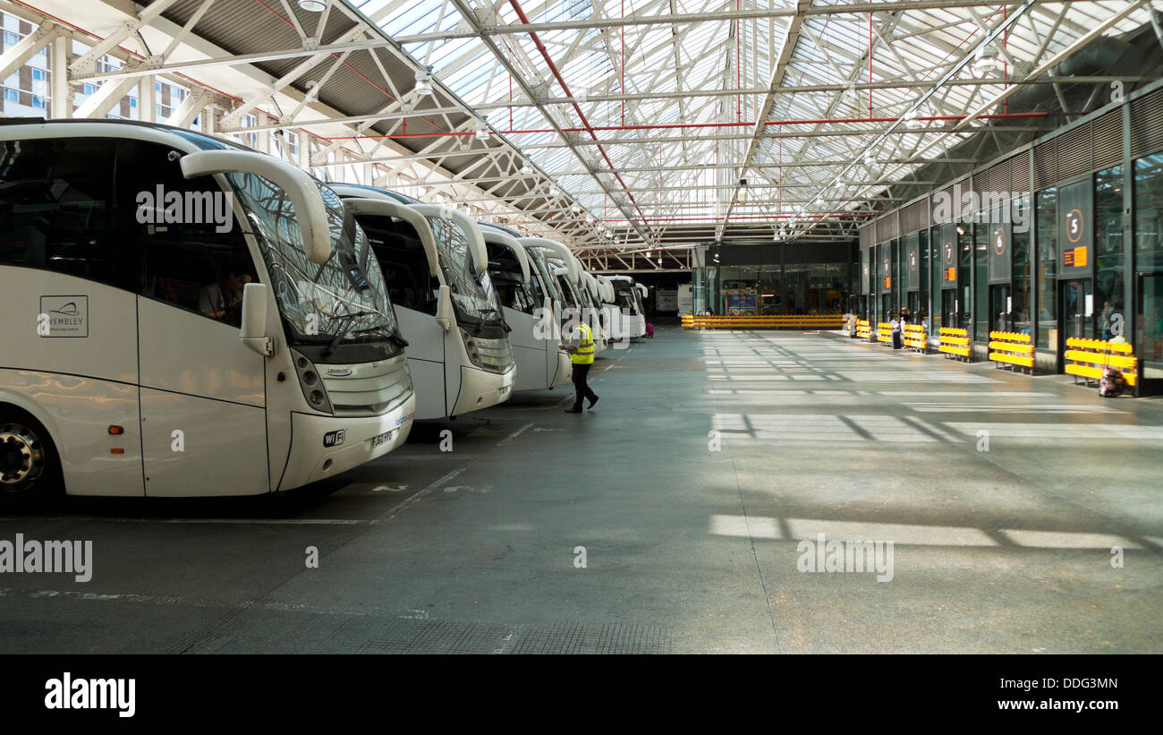 A row of buses in the interior of Victoria Coach Station London Stock Photo  - Alamy