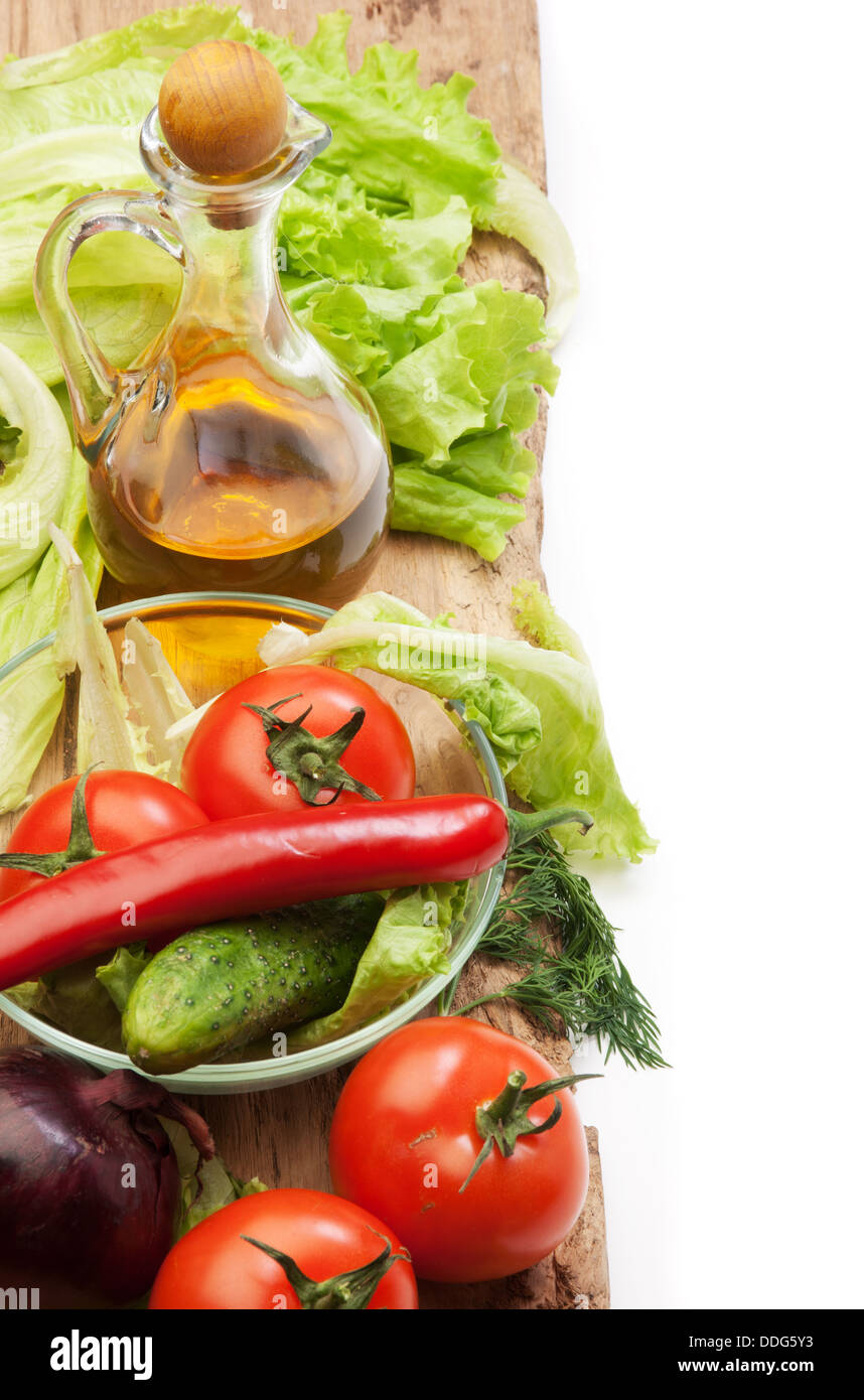 Set vegetable and jug of vegetable oil isolated on the white background