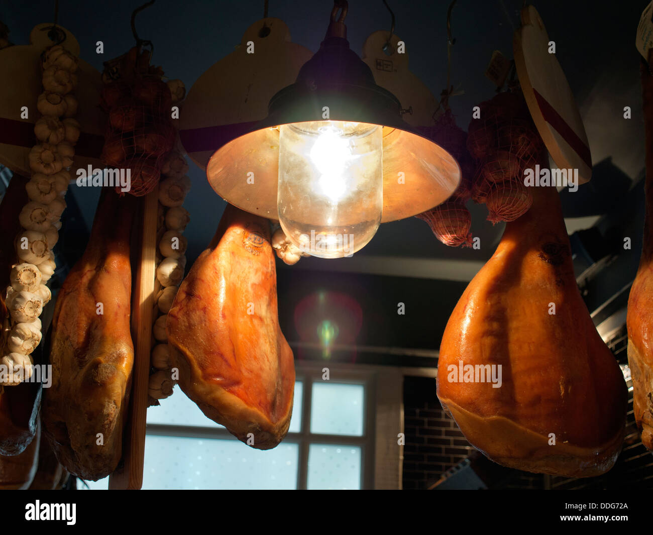Suspended hams in an Italian Restaurant in Oxford, England Stock Photo