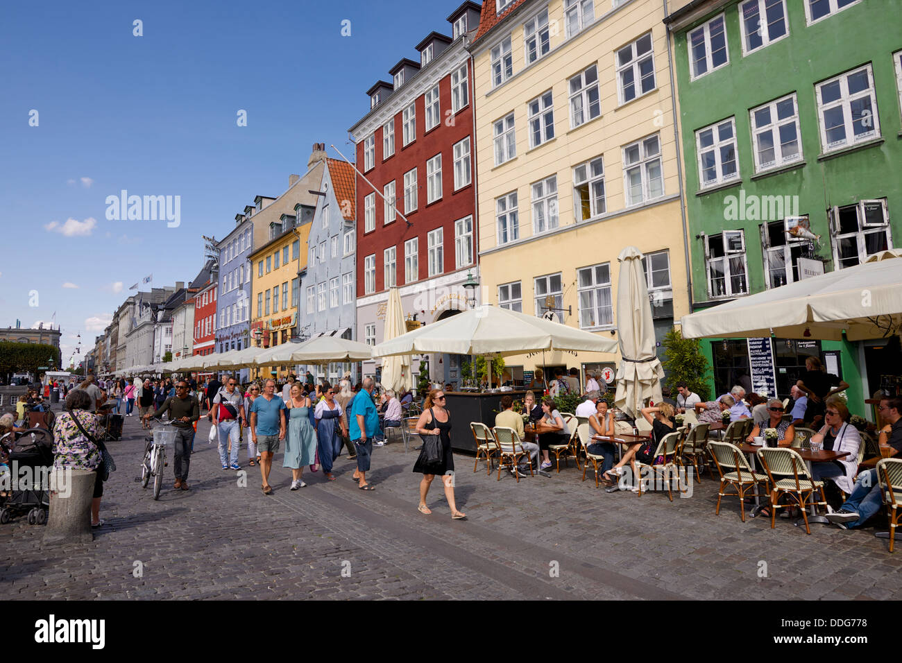 Nyhavn, Copenhagen on a busy summer day with people drinking at the bars Stock Photo