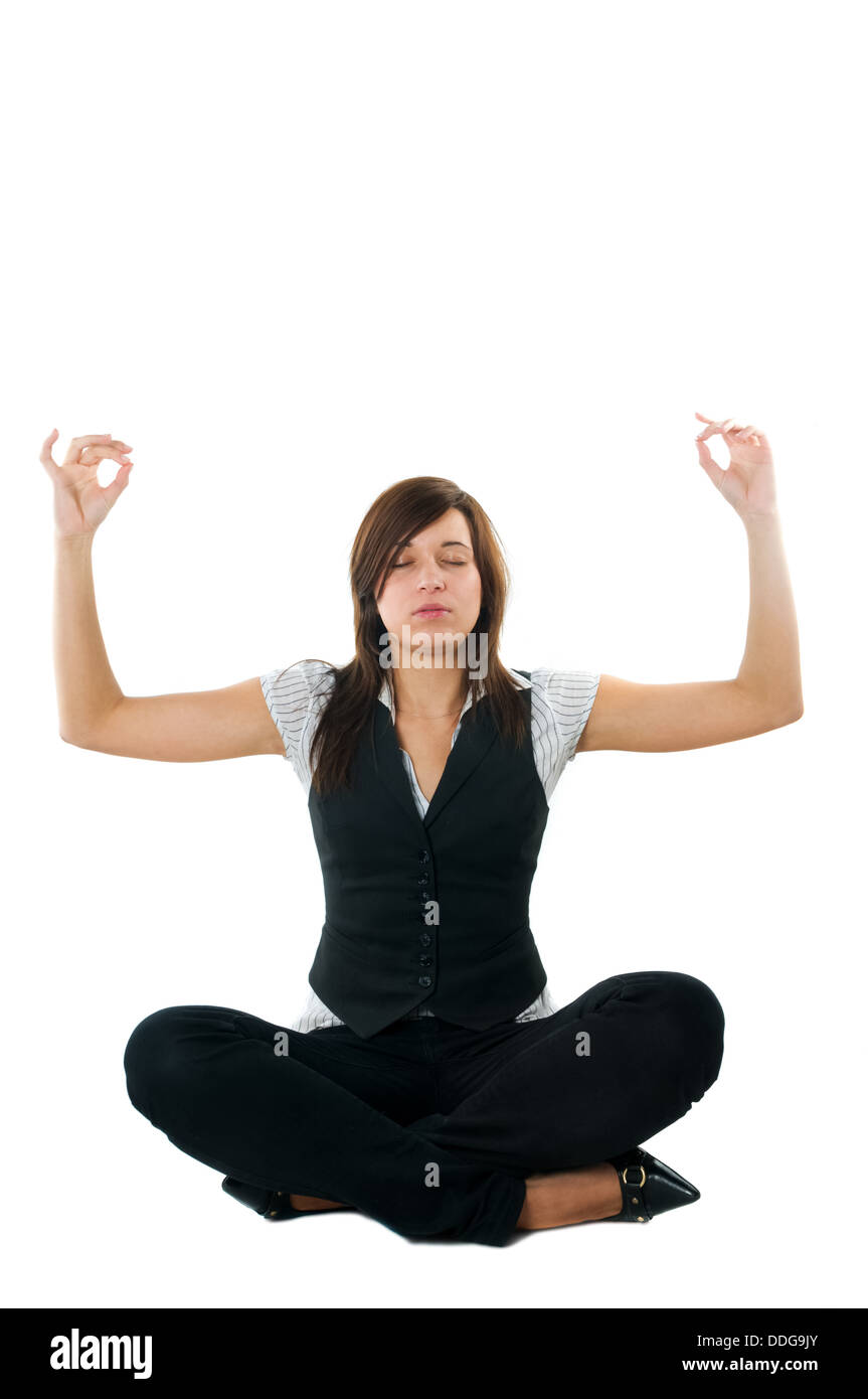Businesswoman relaxing, meditating / doing yoga - isolated on white background Stock Photo
