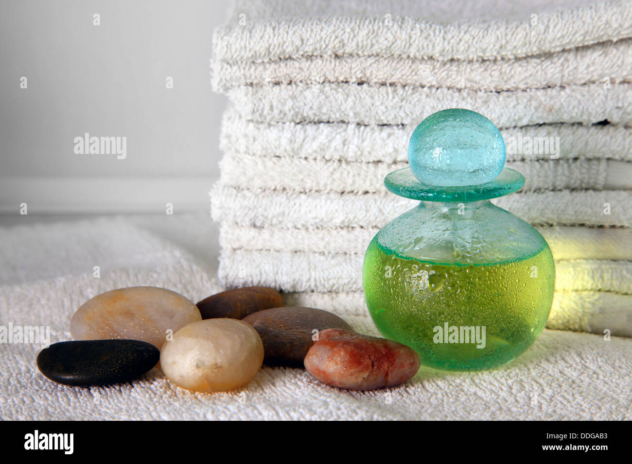 Blue bottle with massage oil Stock Photo Alamy