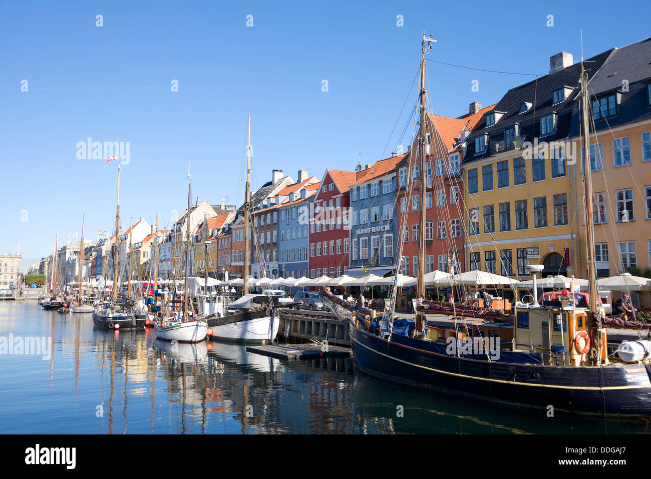 Nyhavn, Copenhagen is a popular destination for socialising with its colorful dockside bars and restaurants Stock Photo