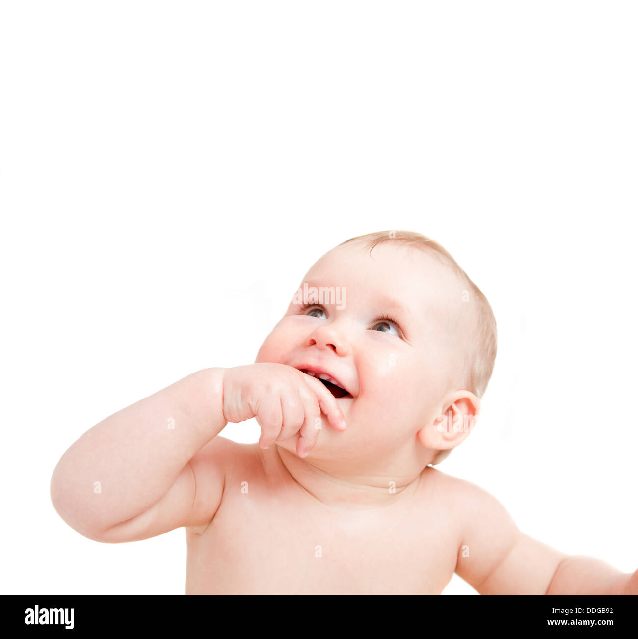 Cute happy baby smiling and looking up. Stock Photo