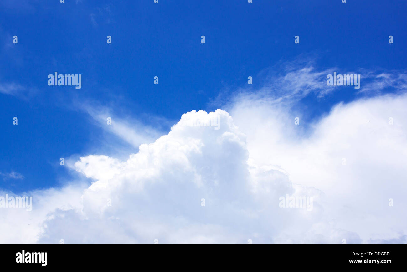 White fluffy clouds in the blue sky Stock Photo - Alamy