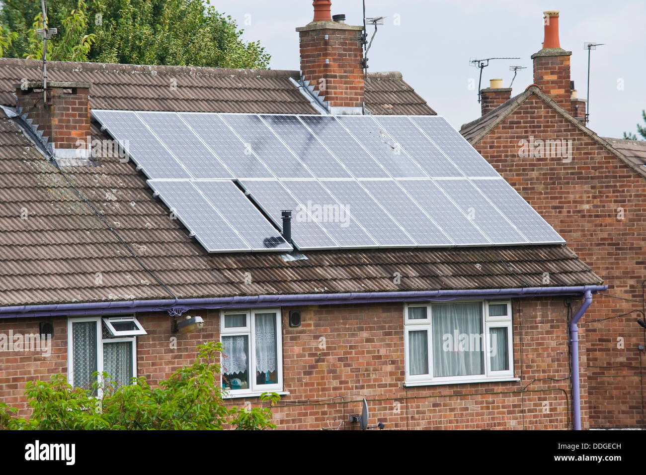 Solar panels on roof of modern house in the city of York North Yorkshire England UK Stock Photo