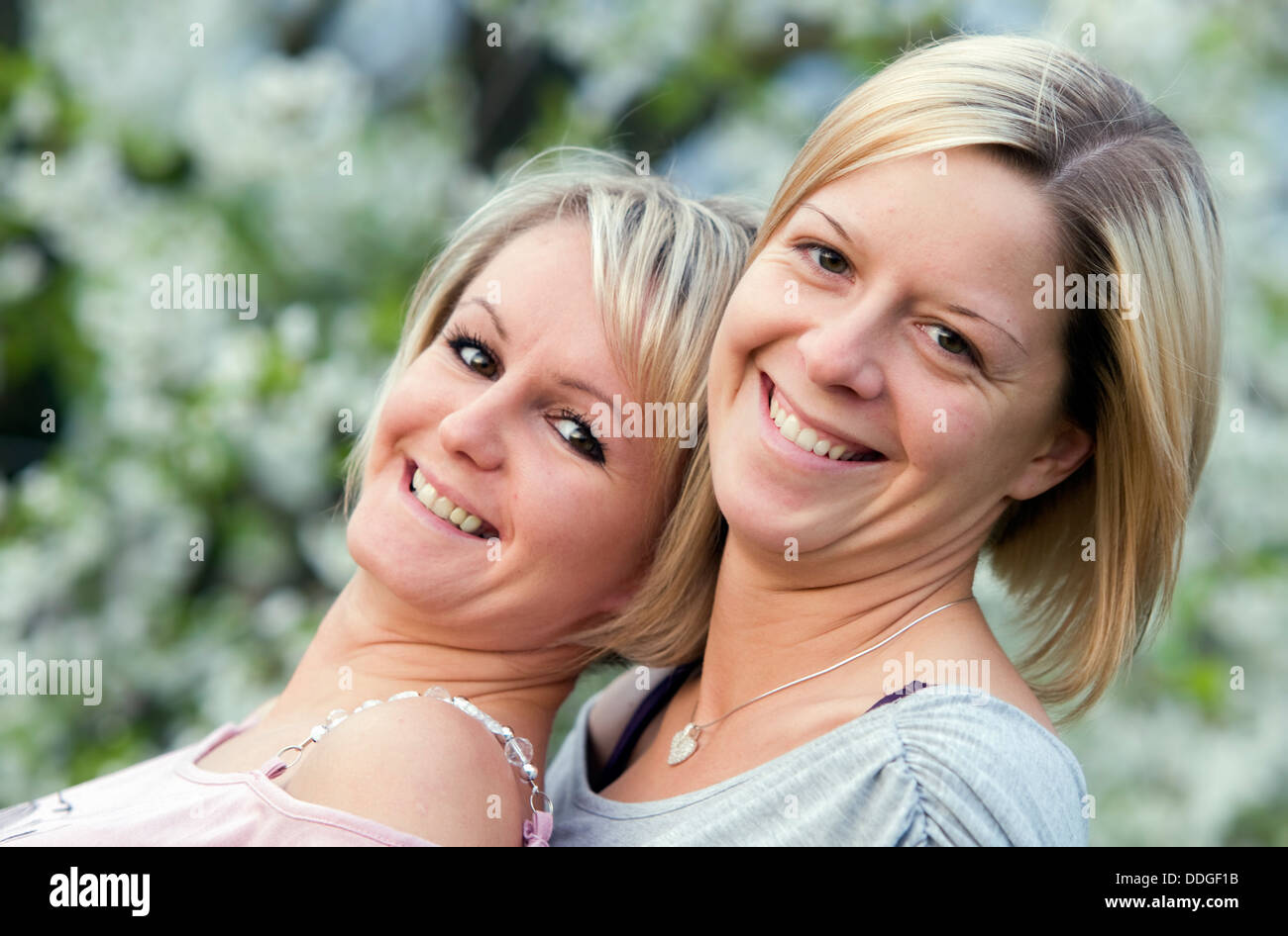 Happy sisters smiling Stock Photo