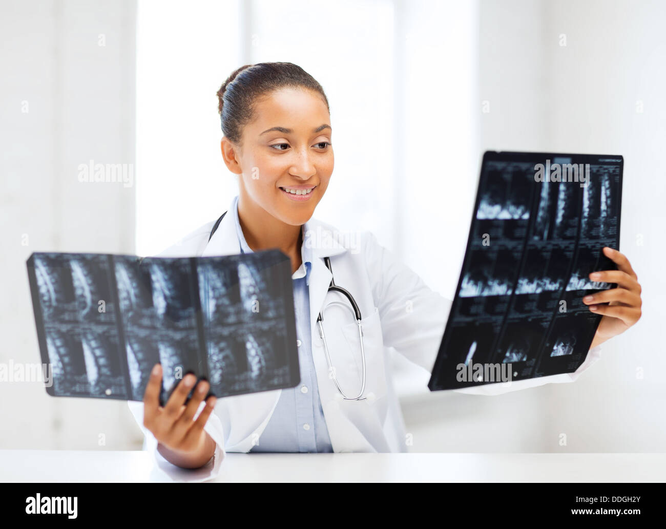 african doctor looking at x-ray Stock Photo - Alamy