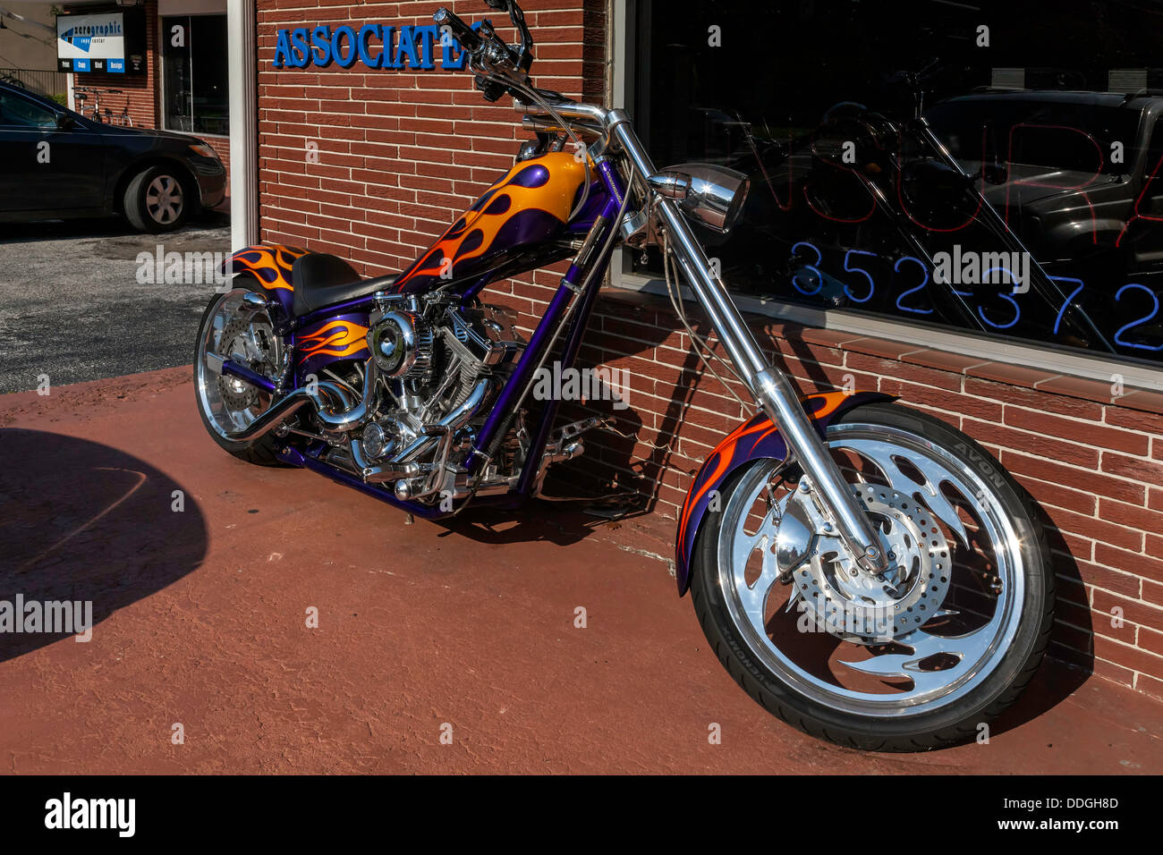 Custom orange and purple flame job paintwork on chopper motorcycle. Stock Photo