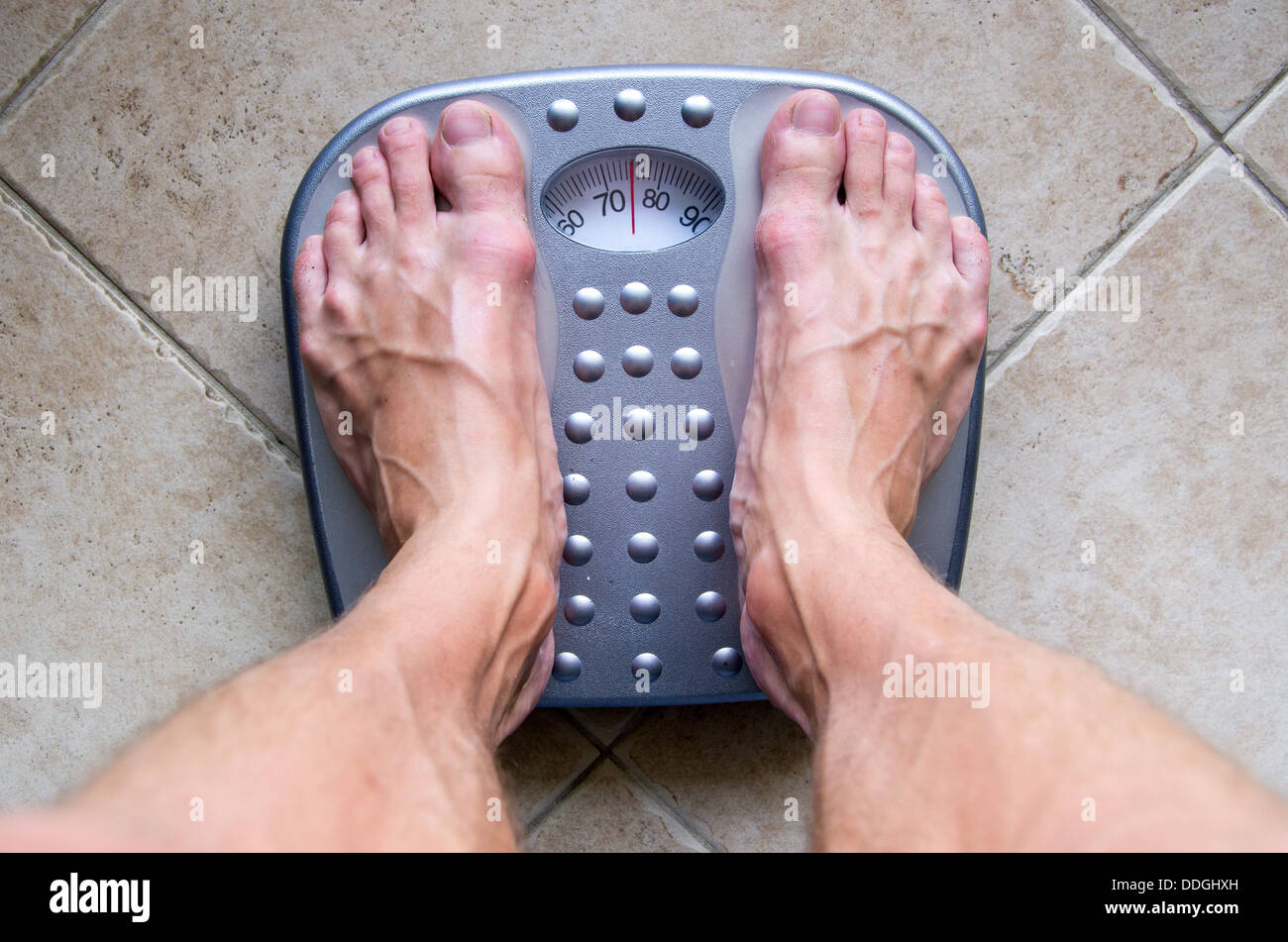 Feet on a scale Stock Photo Alamy