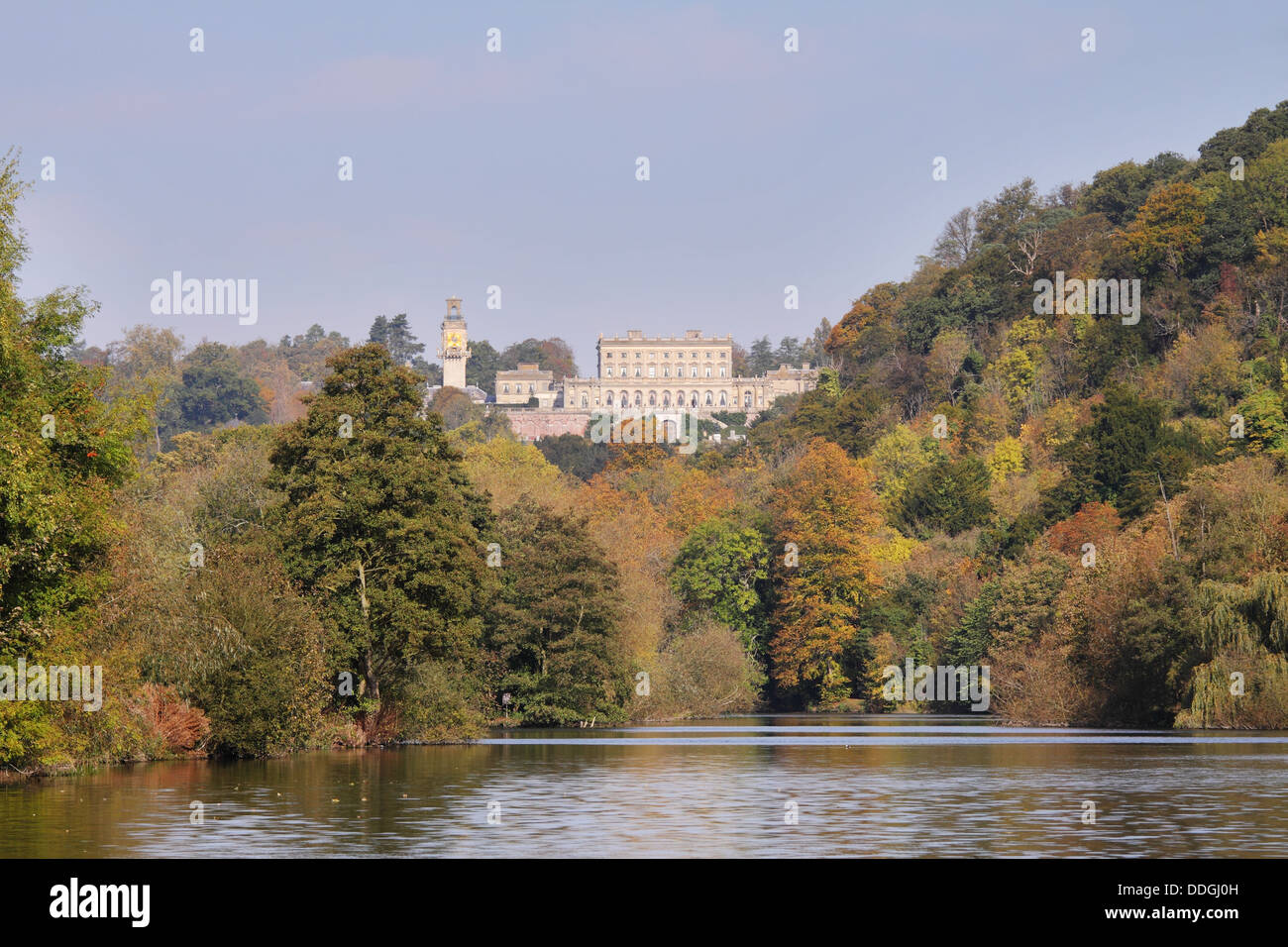 The River Thames in Autumn with the Stately Home of Cliveden amidst the trees Stock Photo