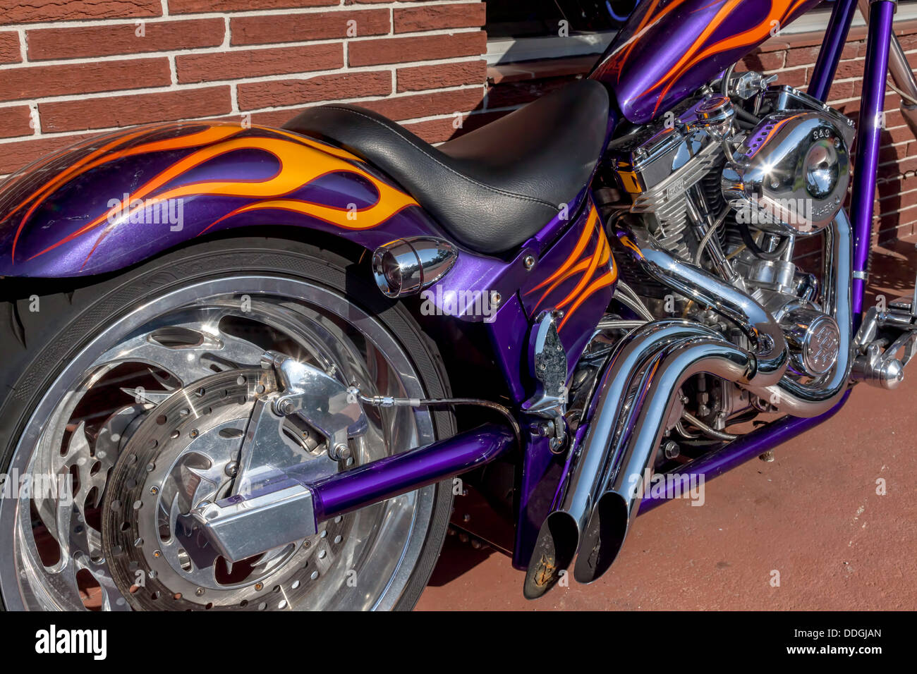 Custom orange and purple flame job paintwork on chopper motorcycle. Stock Photo