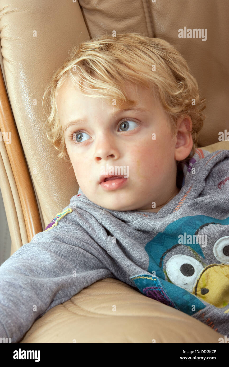 Family photos small child sitting face toddler intense looking Stock