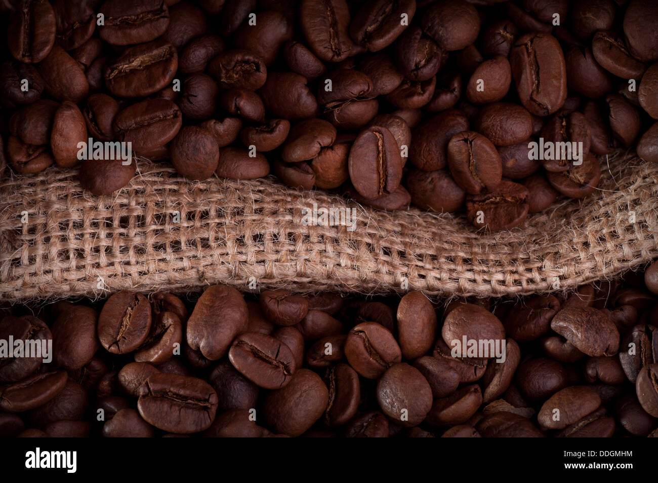 Burlap hessian sack of roasted coffee bean Stock Photo - Alamy
