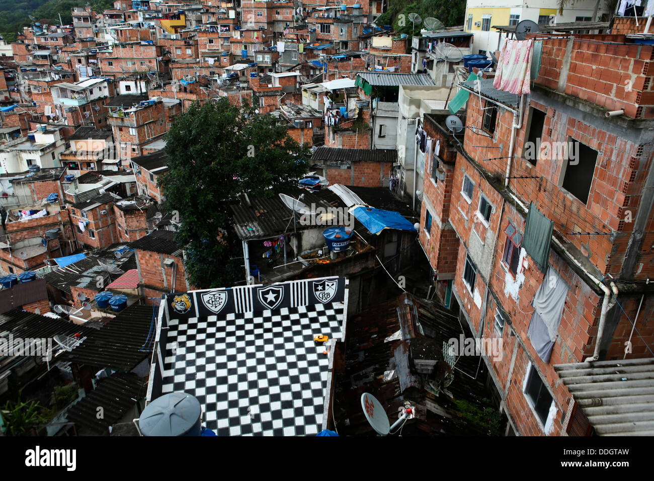 View from top of Favela Santa Marta, Rio de Janeiro, Brazil. A house´ slab-cover ( laje ) used as recreational area, crowding Stock Photo