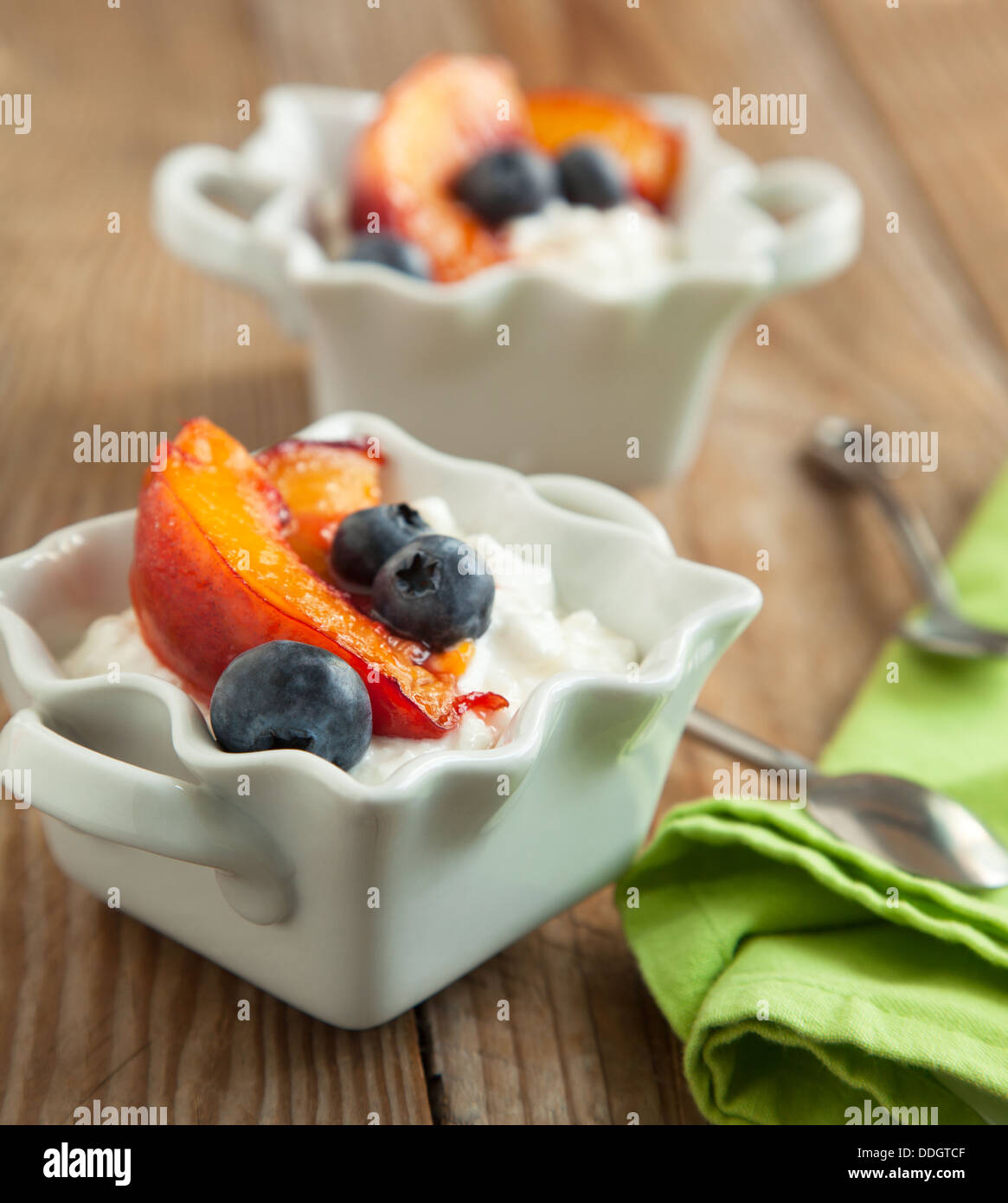 Cottage Cheese With Blueberries And Caramelized Peaches Stock