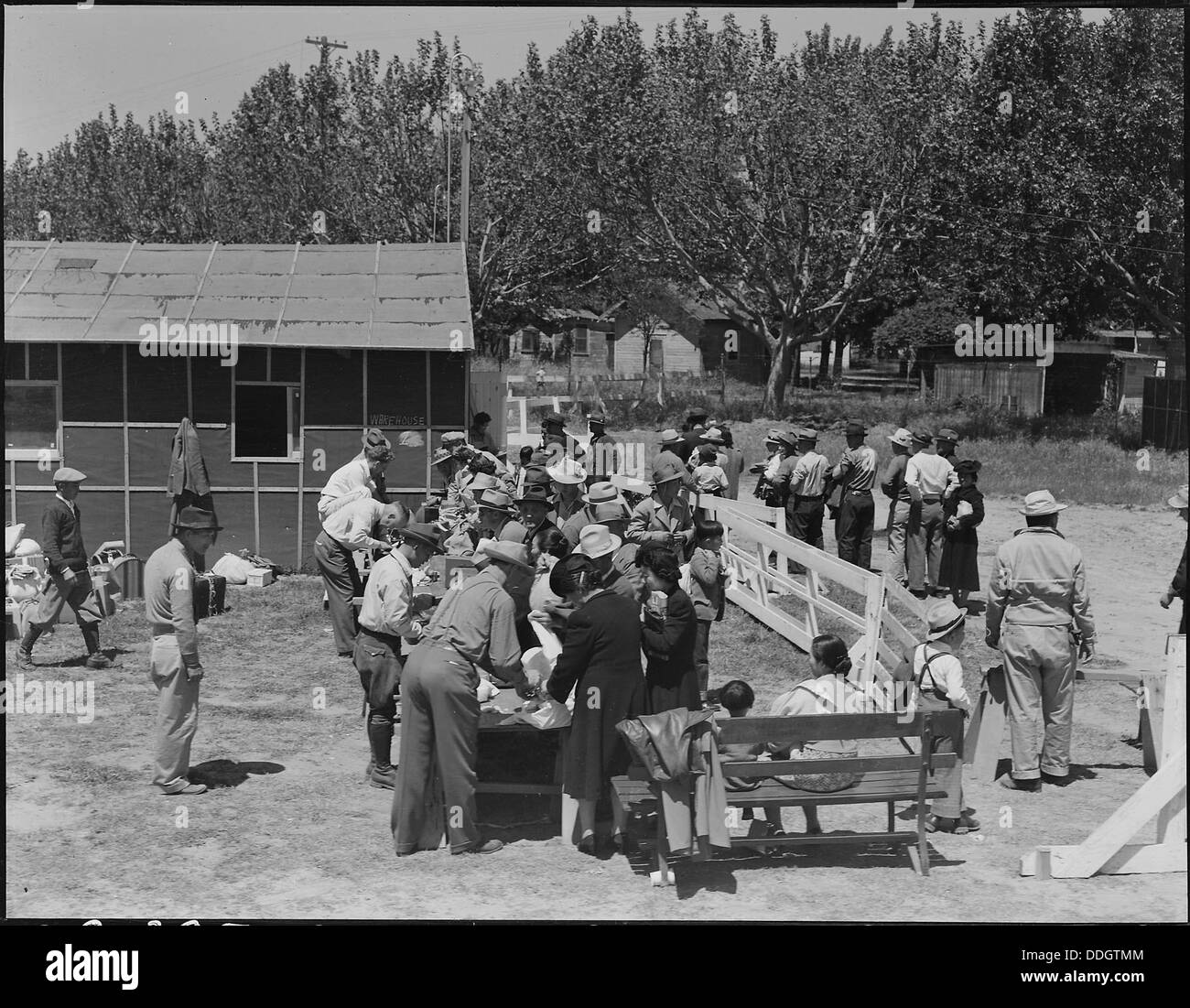 Turlock, California. Baggage is inspected as families arrive at Turlock